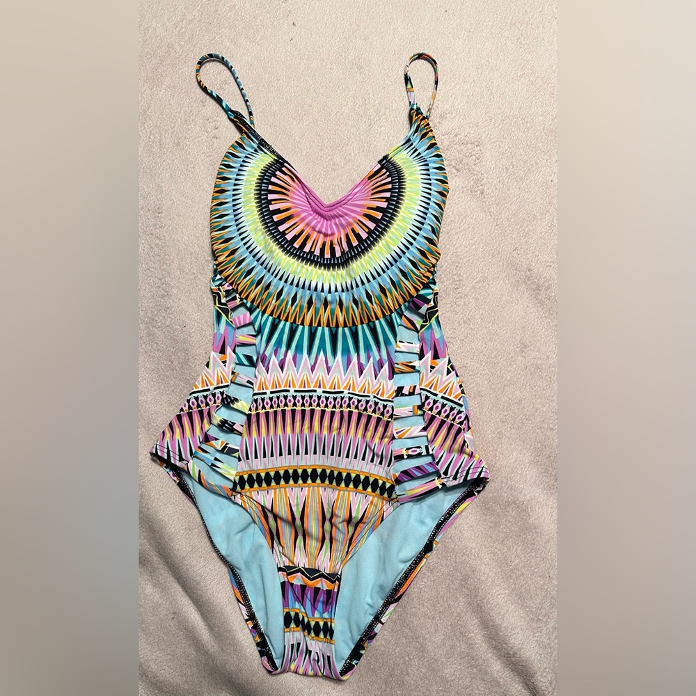 Multi colored bathing suit with cutouts and a cross strap back by bar III